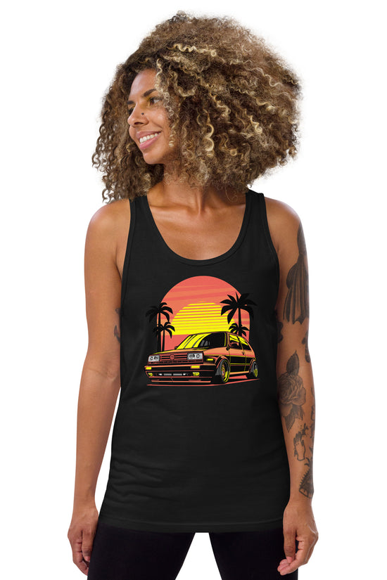 Woman wearing a Sunset Volkswagen Tank Top featuring a vibrant graphic with a sunset and palm trees