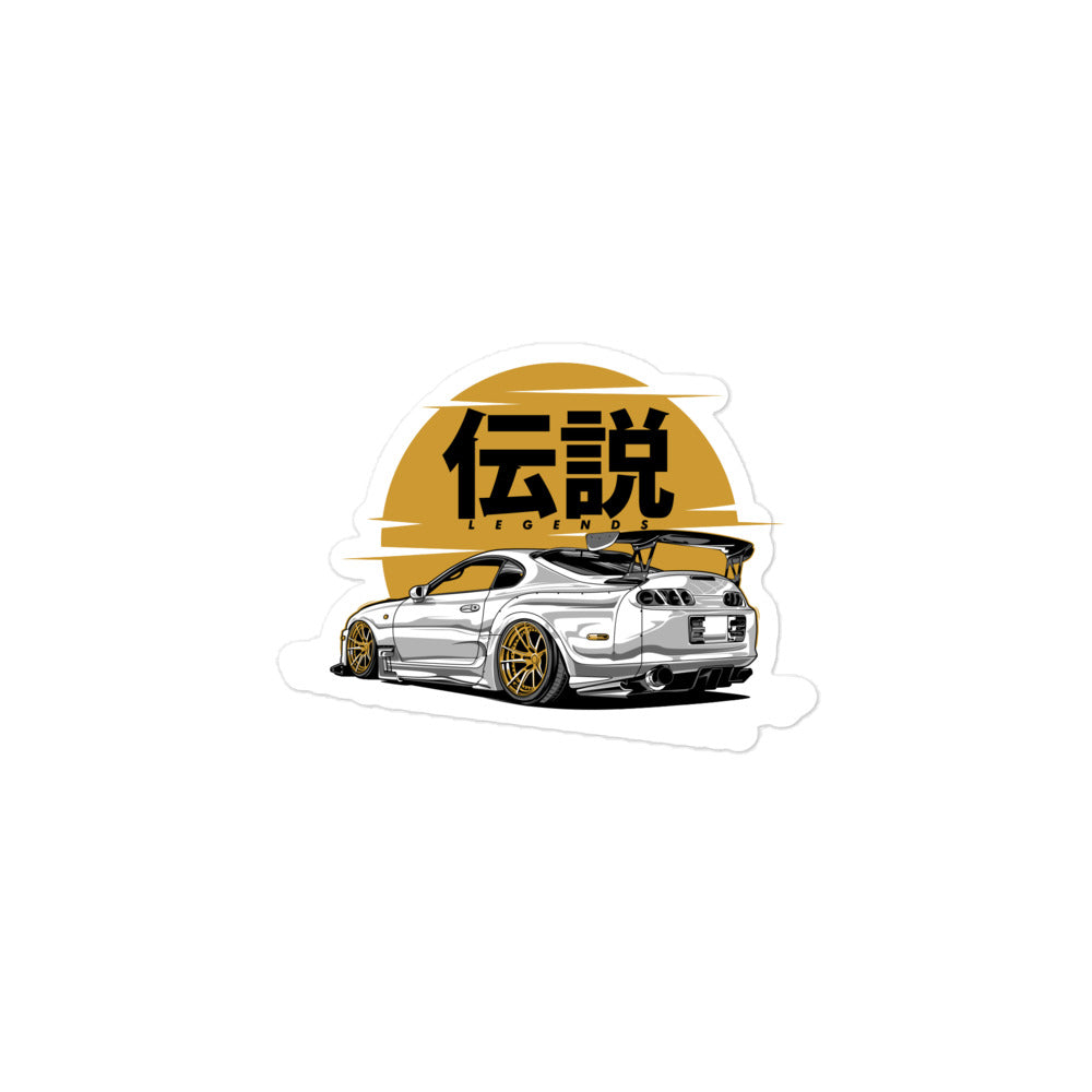 Toyota Supra MK4 Legends Bubble-free sticker | AMPD featuring a sleek car design with a gold backdrop