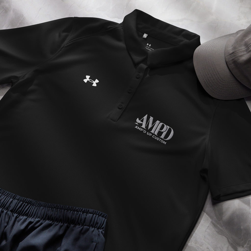 AMPD Official Under Armour Womens polo in black featuring custom logo design for stylish athletic wear
