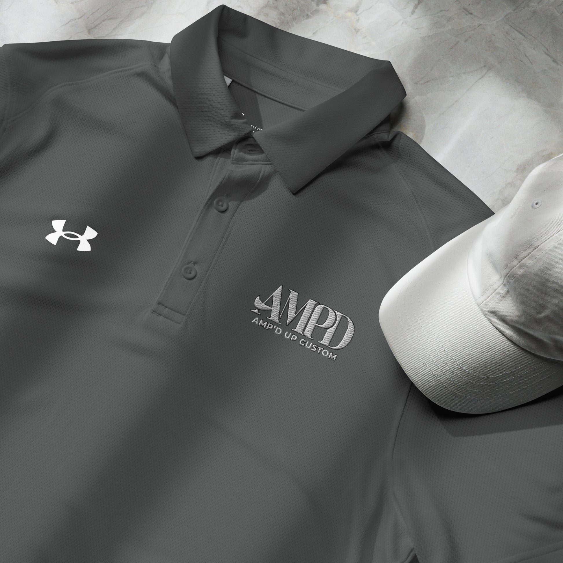 Amp'd Up Official Under Armour Men's Polo in Gray with Embroidered Logo and Matching Cap