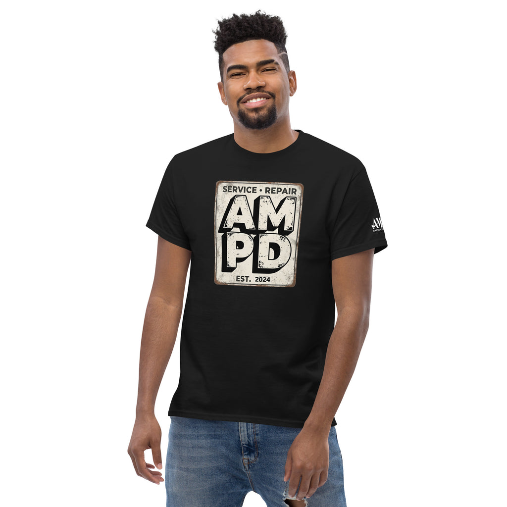 Man wearing a black t-shirt with a graphic design on a white background
