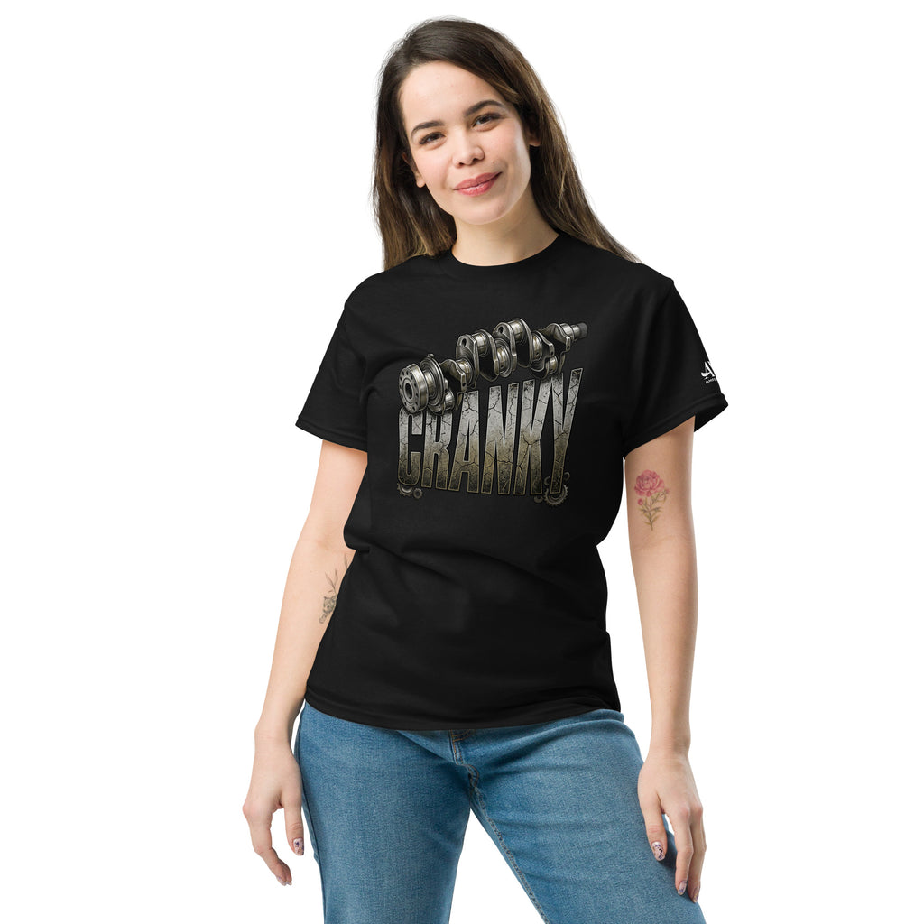 Woman wearing a black t-shirt with a quote on it, standing against a white background