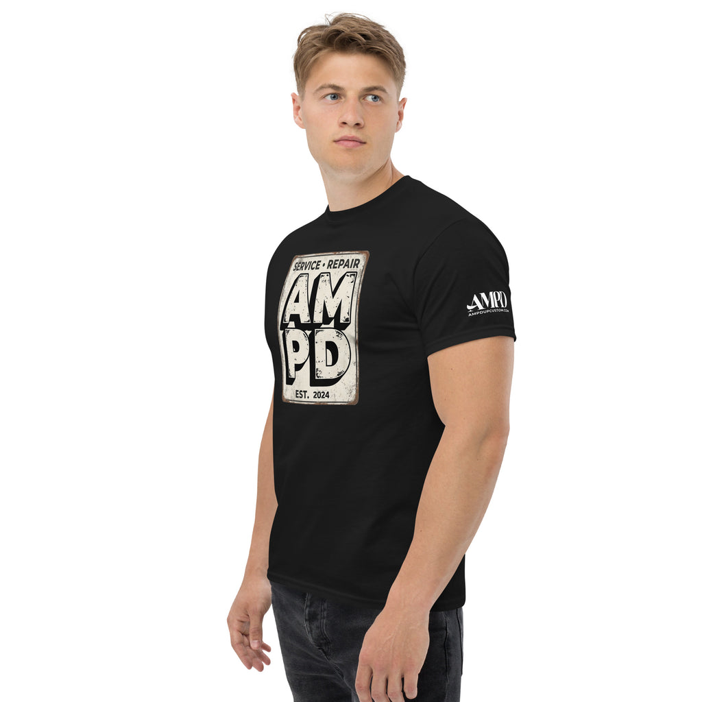 Man wearing a black t-shirt with 'AMPD' logo on a white background
