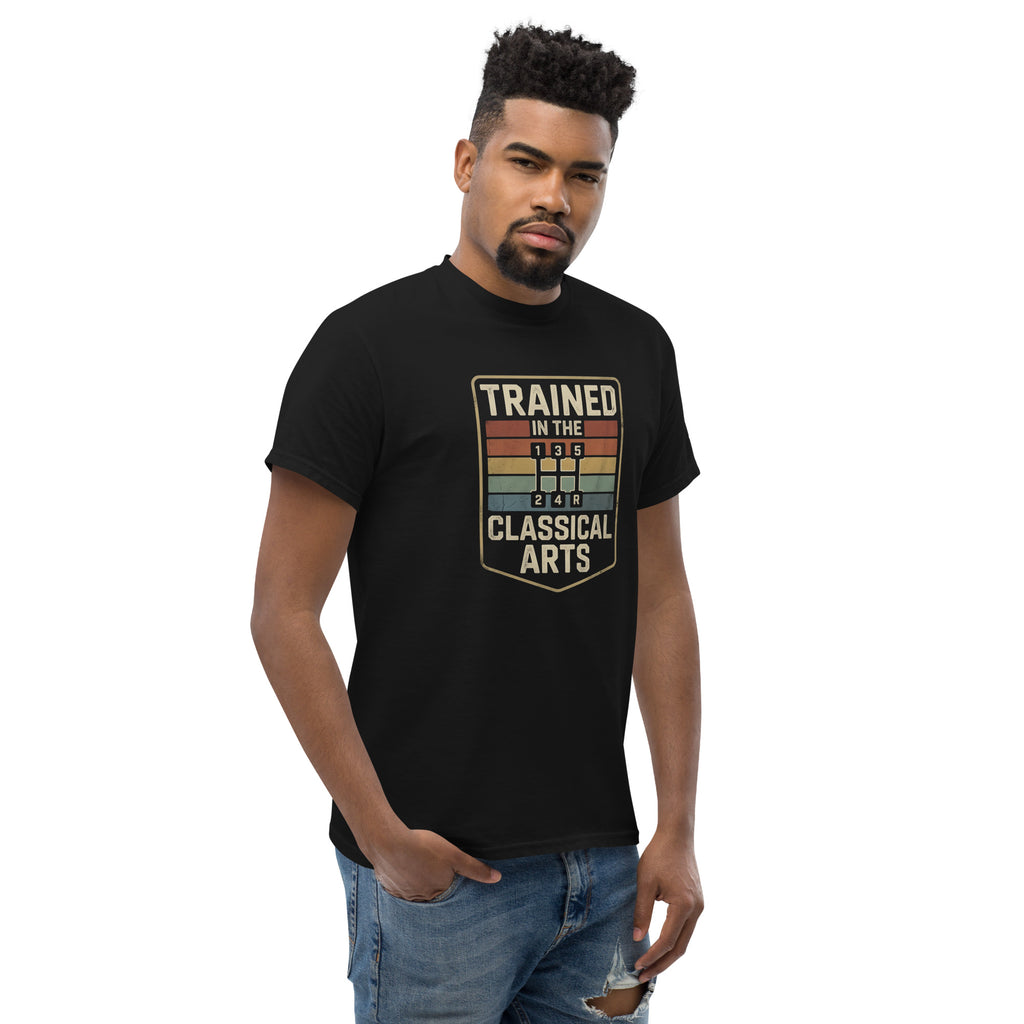 Man wearing a black t-shirt with 'Trained in the Classical Arts' design on a white background