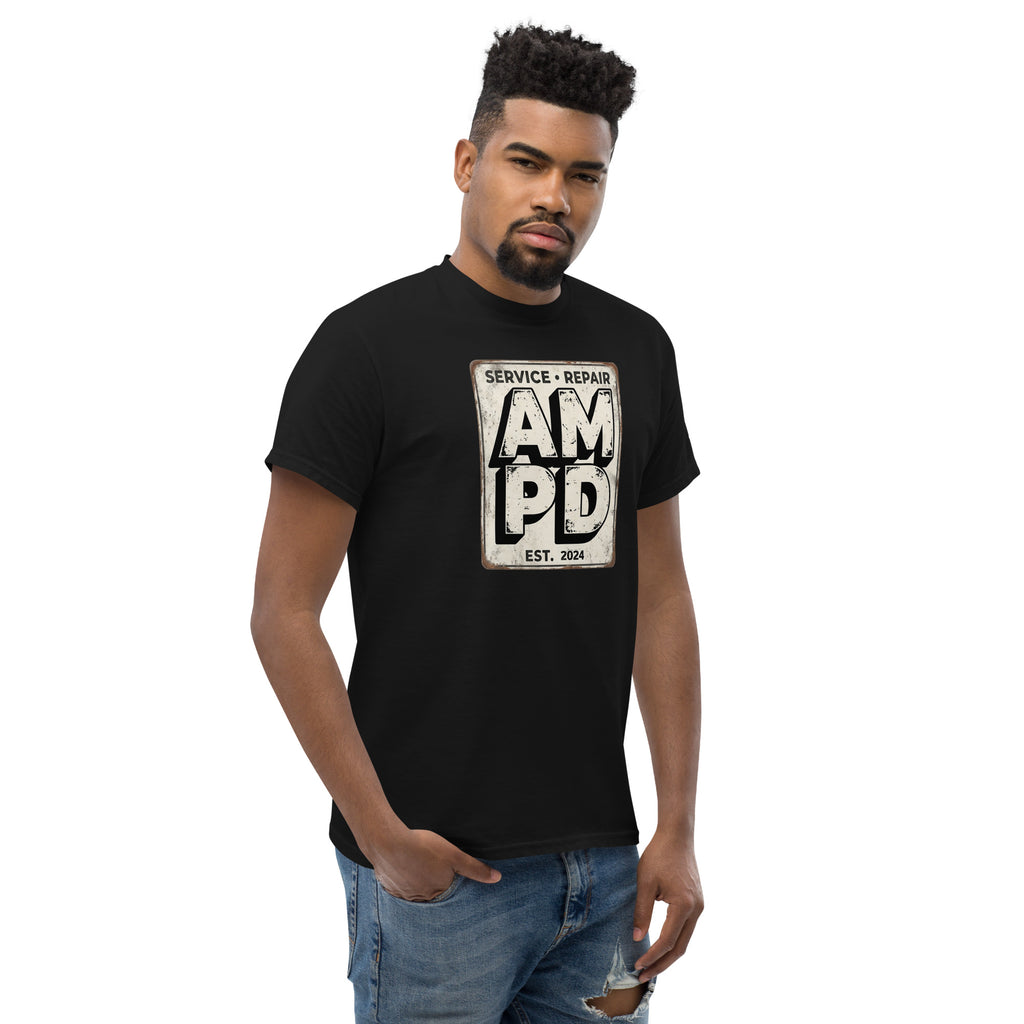 Man wearing a black t-shirt with 'AM PD' logo on a white background