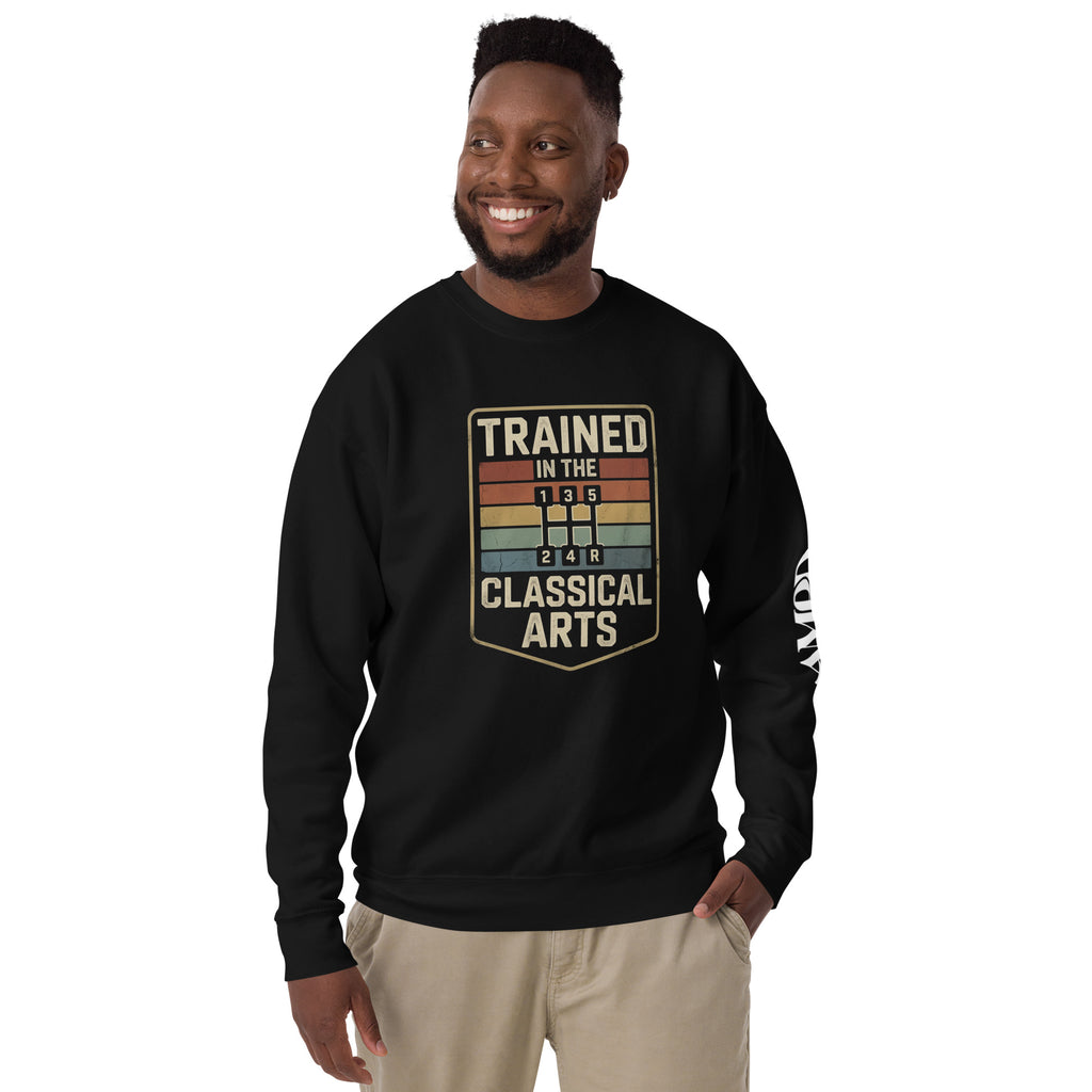 Man wearing a black sweatshirt with 'Trained in the Classical Arts' text on a white background