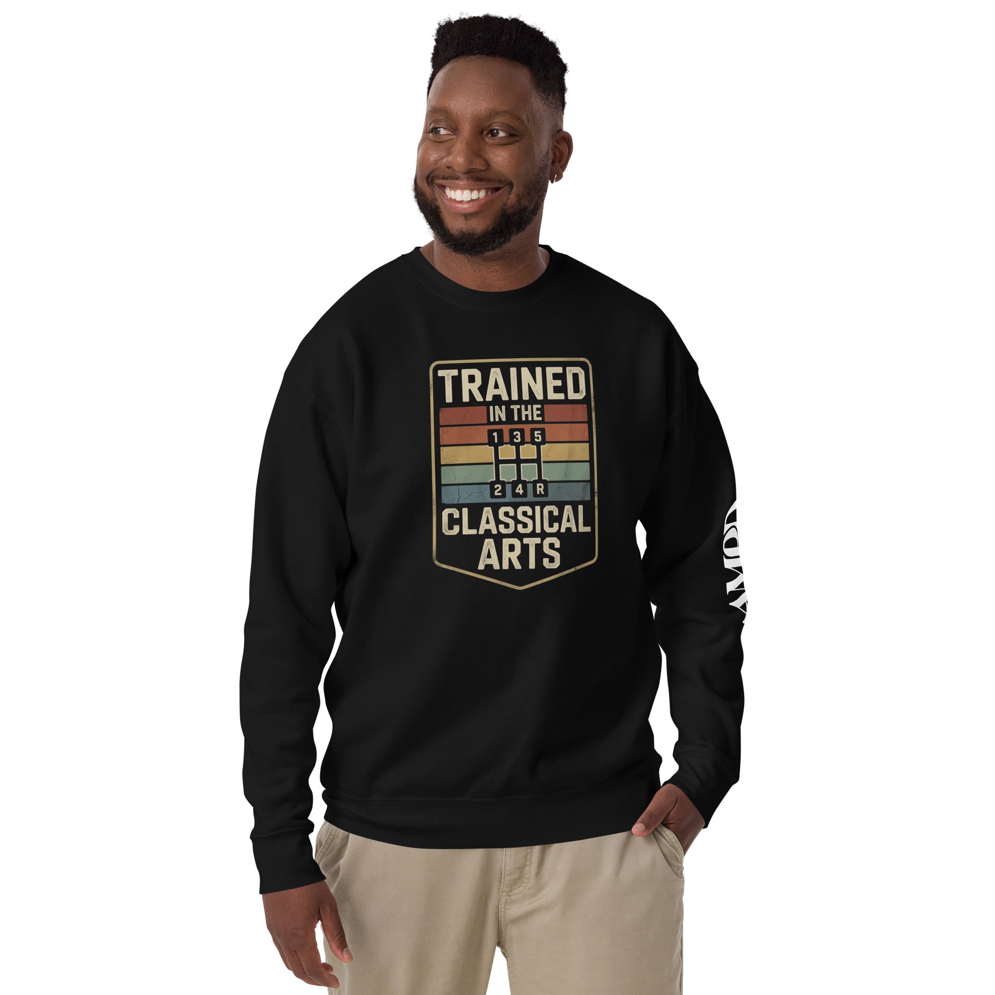 Man wearing a black sweatshirt with 'Trained in the 1970s Classical Arts' text on a white background