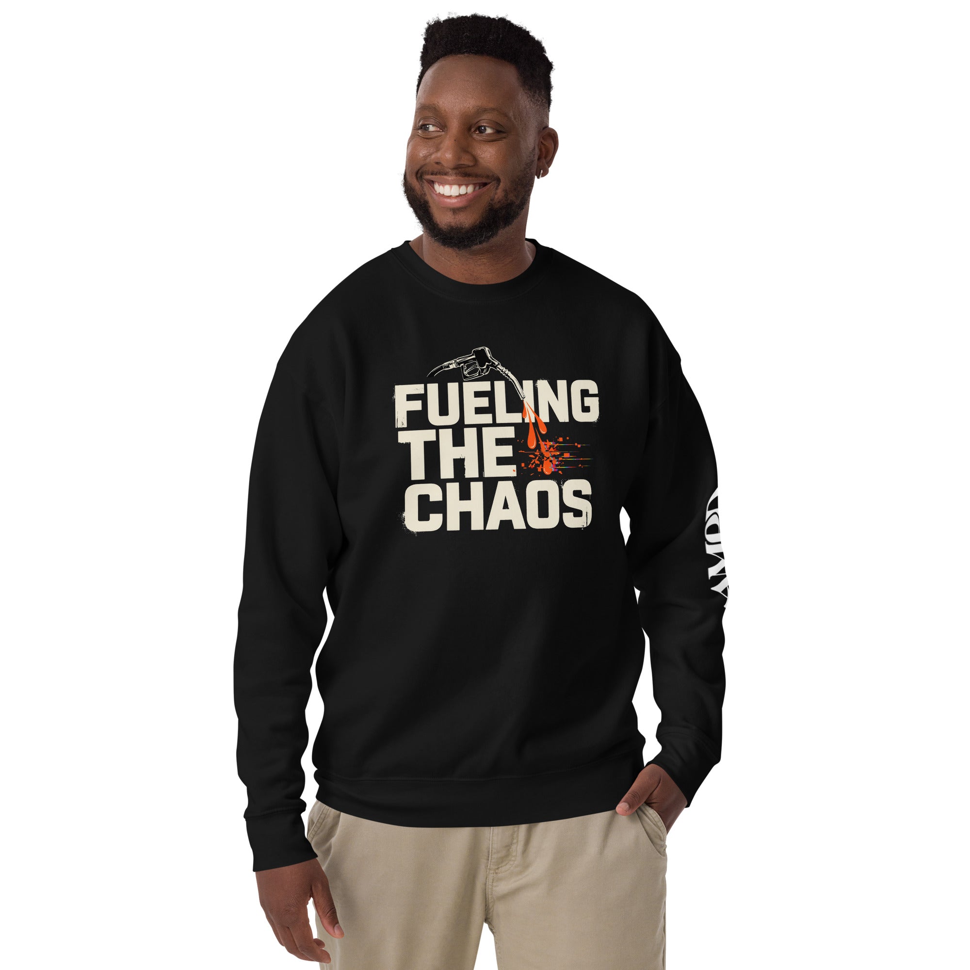 Man wearing a black sweatshirt with 'Fueling The Chaos' text and graphic on a white background