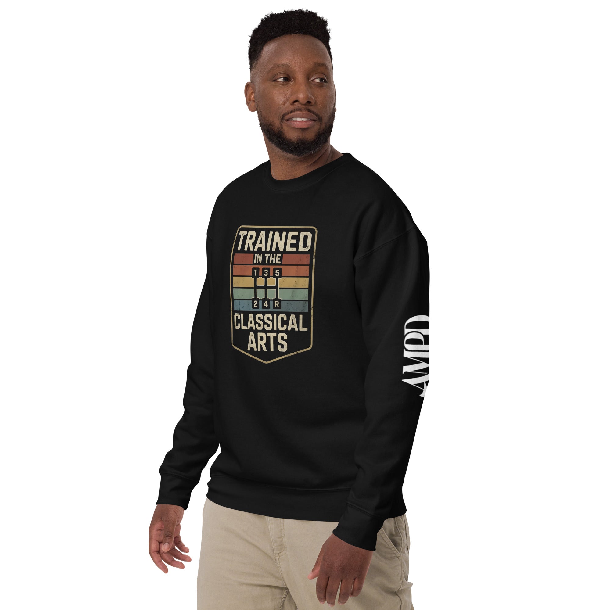 Man wearing a black sweatshirt with 'Trained in the Classical Arts' text on a white background