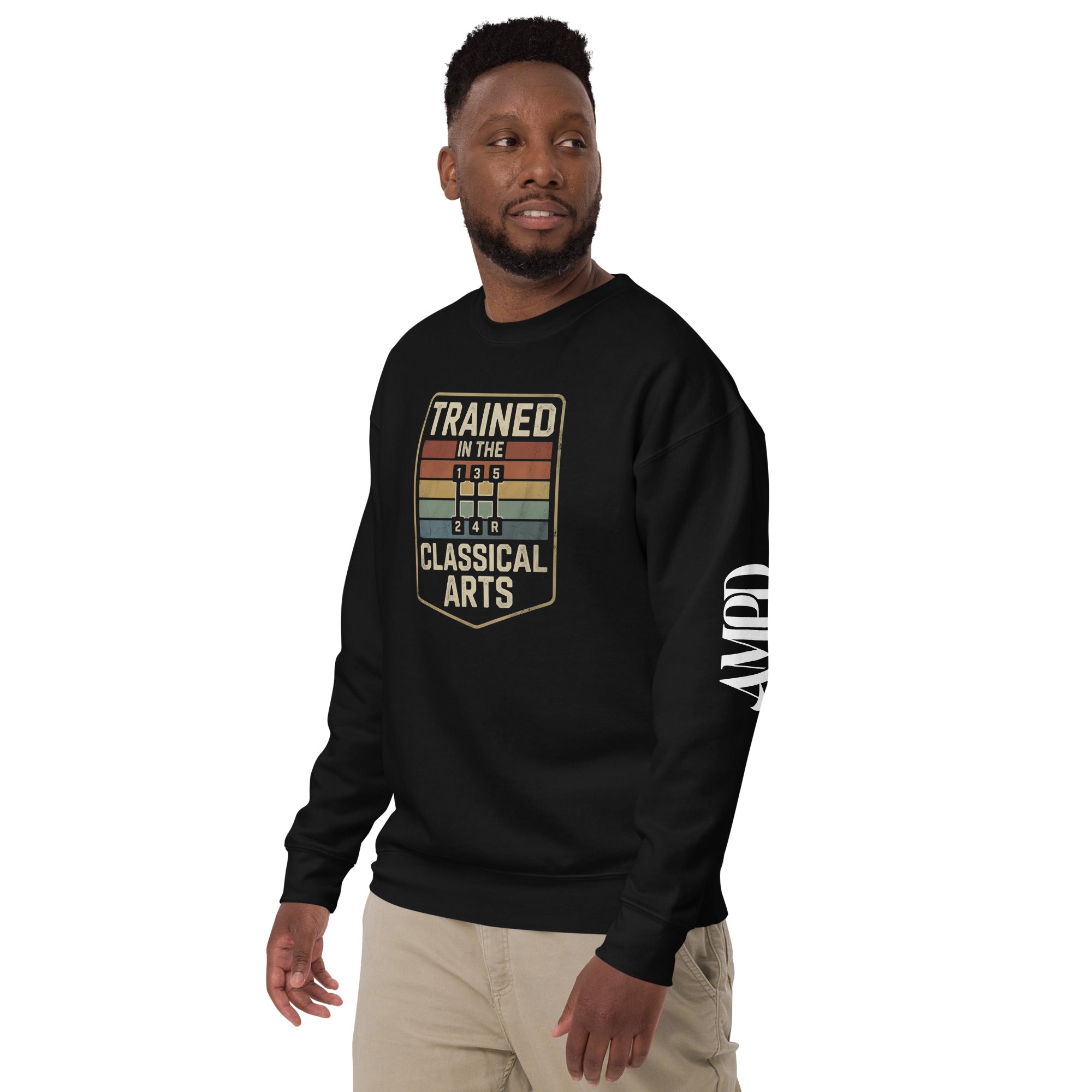 Man wearing a black sweatshirt with 'Trained in the Classical Arts' text on a white background