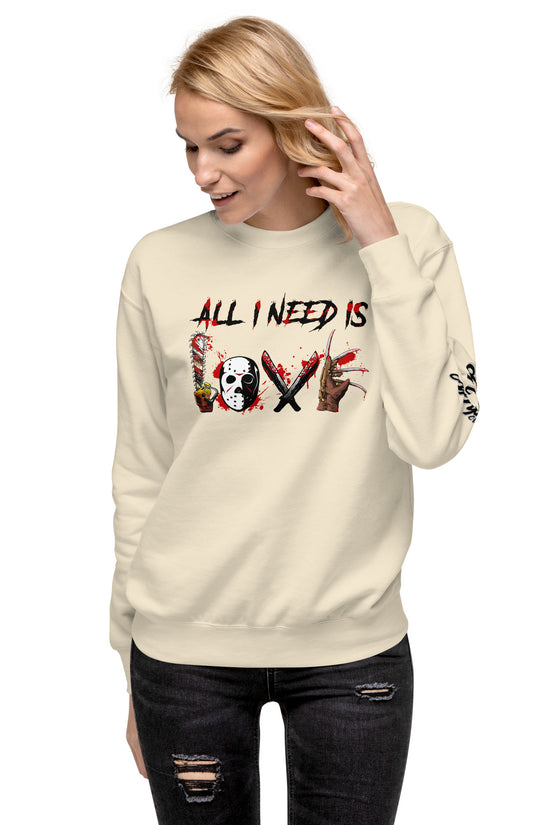 Woman wearing a cream All I Need Is Love Sweatshirt by Amp'd Up Custom with graphic text design
