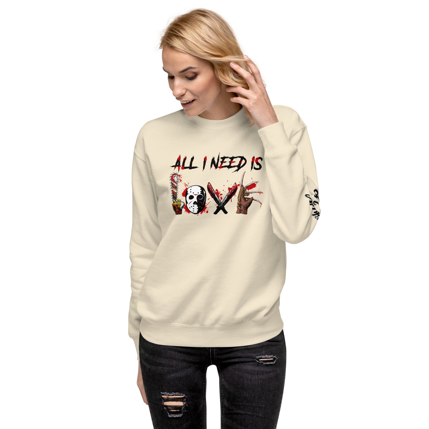 Woman wearing a cream All I Need Is Love Sweatshirt by Amp'd Up Custom with graphic text design