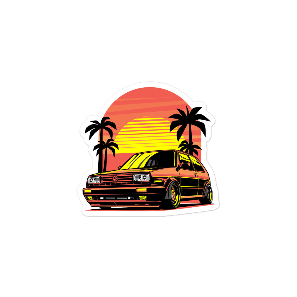 Amp'd Up Custom Volkswagen sticker featuring a retro car design with a sunset and palm trees