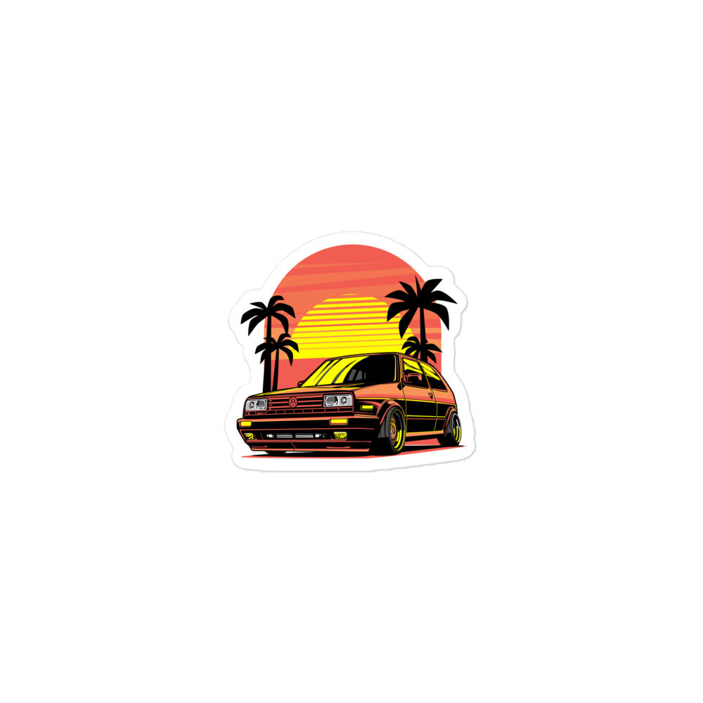 Colorful Volkswagen sticker featuring a retro car design with palm trees and a sunset background